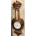 An Edwardian walnut aneroid wheel barometer / thermometer, height 98cm