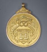 A 1930's 9ct gold 'Staffordshire Football Association' pendant medal, presented to S.Lawson for long