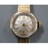 A ladys' 1960's 9ct gold Tissot wristwatch on integral tapered bracelet, total 15.9g.