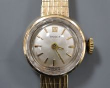 A ladys' 1960's 9ct gold Tissot wristwatch on integral tapered bracelet, total 15.9g.