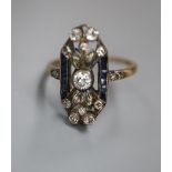 A 1920's? Austrian pierced yellow metal, diamond and sapphire set upfinger dress ring, size Q, gross