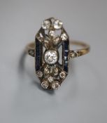 A 1920's? Austrian pierced yellow metal, diamond and sapphire set upfinger dress ring, size Q, gross