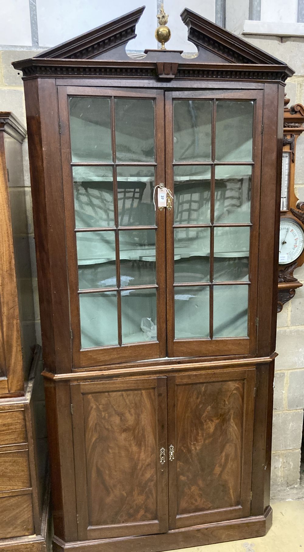 A George III mahogany standing corner cabinet, width 104cm, depth 48cm, height 224cm