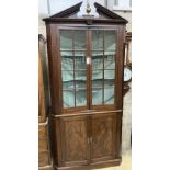 A George III mahogany standing corner cabinet, width 104cm, depth 48cm, height 224cm