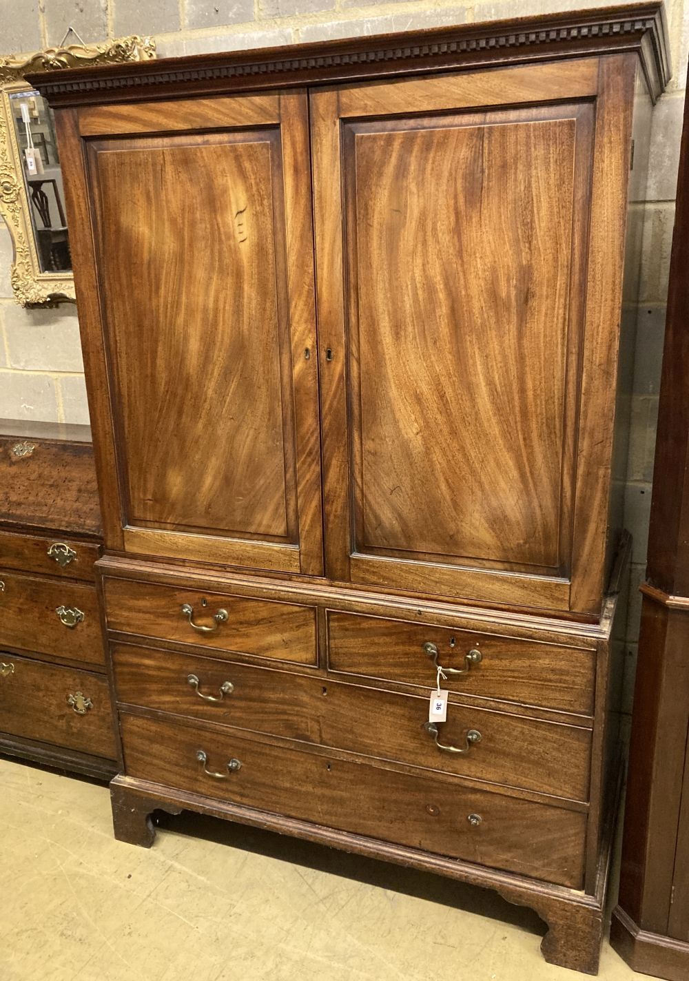 A George III mahogany linen press, width 124cm, depth 61cm, height 185cm