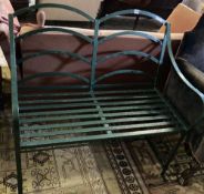 A painted wrought iron garden bench, width 102cm, depth 49cm, height 96cm