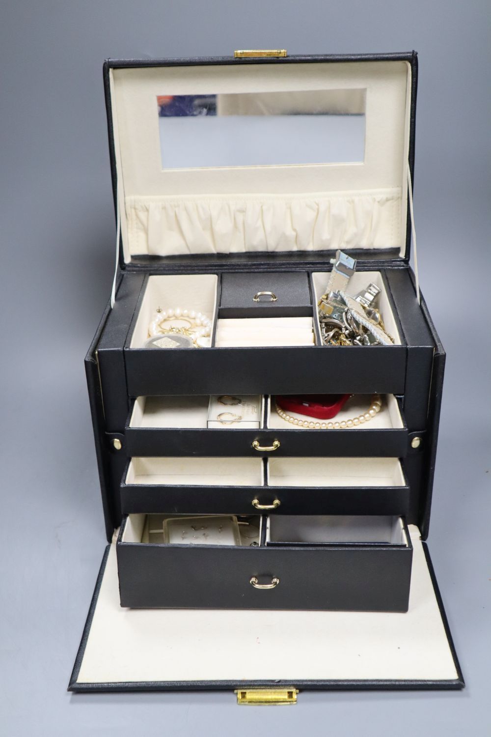 A quantity of costume jewellery, some in silver, in a case and a box.