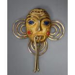 A modern 18k yellow metal and gem set African? mask pendant, overall 4cm, gross 6.3 grams.