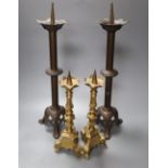 A pairs of brass pricket candlesticks, height 40cm and a pair of bronze pricket candlesticks, height
