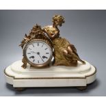 A Louis XVI style white marble mantel clock, with seated female surmount, French bell-striking