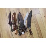 Three kukris, a kris and other daggers or knives, longest item 41cm