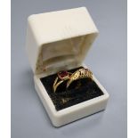 A late Victorian 22ct gold and solitaire garnet set ring, size O (adapted?), gross 2.5 grams and