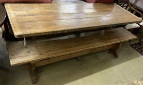 A Victorian style rectangular pine refectory table and a two bench seats, table width 203cm, depth