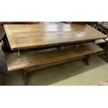 A Victorian style rectangular pine refectory table and a two bench seats, table width 203cm, depth