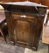 A late 18th century inlaid oak hanging corner cupboard, width 77cm depth 43cm height 108cm