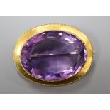 A Victorian oval amethyst brooch in yellow metal mount (tests as 14ct), gross 11.5 grams, 35mm.