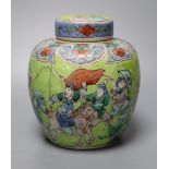 A Chinese lime green ground famille verte jar and cover, late 19th century, 15cm