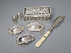 A Victorian silver trinket box, three silver wine labels, a Victorian silver butter knife & two