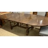 An early 18th century style French oak extending dining table, with two leaves, 268cm extended,