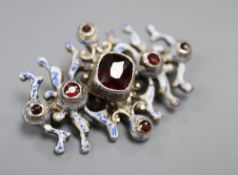An early 20th century Austro-Hungarian? white metal, garnet and enamel set brooch, 43mm, gross 13.