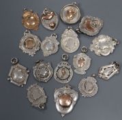 Fifteen assorted silver medallions (133 grams) and a 9ct gold medal (6.5grams).