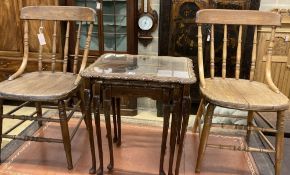 A nest of three walnut tea tables and a pair of early 20th century ash comb back dining chairs