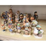 Nineteen Hummel figures or groups, a Beswick spaniel and another figure, tallest 16.5cm (21)