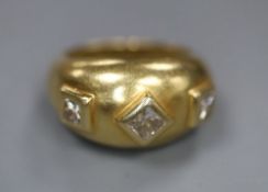 An 18k and three stone square cut diamond set ring, size M, gross 10.8 grams.CONDITION: No visible