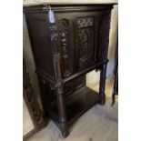 A medieval style oak cabinet on stand, width 90cm, depth 44cm, height 140cm
