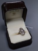 A 1920's? Austrian pierced 585 yellow metal and diamond set cluster ring, size O/P, gross 3.8