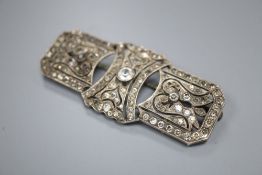 A 1920's style pierced white metal and paste set brooch, 64mm.