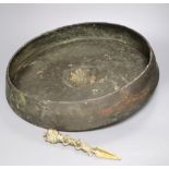 A Himalayan bronze phurba, 19.5cm and an Oriental gong, diameter 46cm