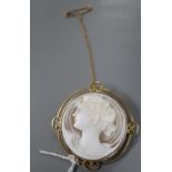 An Edwardian 9ct mounted circular cameo shell brooch, carves the bust of a lady to dexter, 46mm,