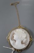 An Edwardian 9ct mounted circular cameo shell brooch, carves the bust of a lady to dexter, 46mm,