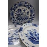 Two 18th century Delft blue and white dishes and a similar English delftware dish, 34-35cm, all a.