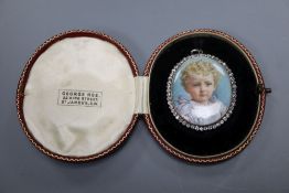 A late Victorian yellow metal and diamond set oval portrait miniature, in fitted gilt tooled leather