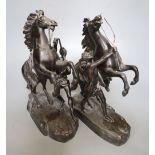 After Cousteau. A pair of early 20th century bronze Marli horse groups, 29cm high