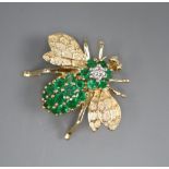 A modern 14k yellow metal, emerald cluster and diamond set bee brooch, width 3cm, gross 8.4 grams.