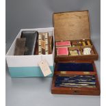 An oak cased games compendium, cased drawing instruments, binoculars, a Tunbridge ware cribbage