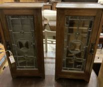 A pair of oak and leaded glass side cabinets, width 32cm, depth 21cm, height 64cm