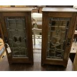 A pair of oak and leaded glass side cabinets, width 32cm, depth 21cm, height 64cm