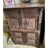 A 19th century Flemish carved oak four drawer cabinet, width 124cm, depth 70cm, height 150cm
