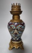 A 19th century French champleve-enamelled oil lamp, with gilt metal mounts, height 19cm