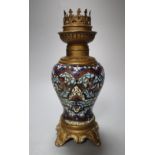 A 19th century French champleve-enamelled oil lamp, with gilt metal mounts, height 19cm