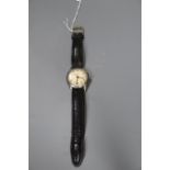 A gentleman's 1950's steel Longines manual wind wrist watch, on later strap, case diameter 34mm,