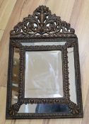 A 17th century style brass cushion mirror, overall height 59cm