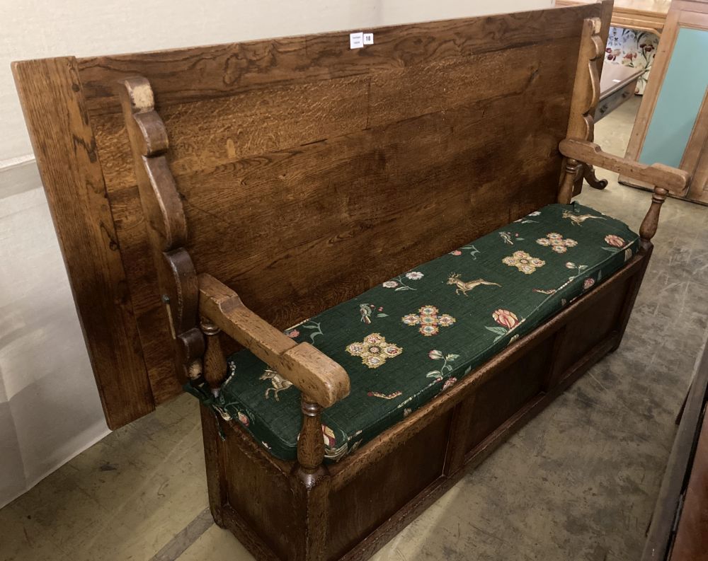 An 18th century style oak monks bench / hall table, width 199cm, depth 72cm, height 117cm