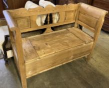 A late 19th century Continental pine box seat settle, width 124cm, depth 48cm, height 91cm