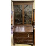 A George III mahogany bureau bookcase, width 100cm, depth 52cm and 26cm top, height 221cm