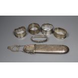 A silver spectacle case, four silver napkin rings and a Norwegian 830S napkin ring.